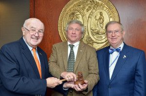 Outgoing SCDOT Commission Chairman Jim Rozier, left, passes the gavel to newly elected Chairman Mike Wooten, center, and Vice-Chairman John Hardee. (Photo by Rob Thompson/SCDOT)